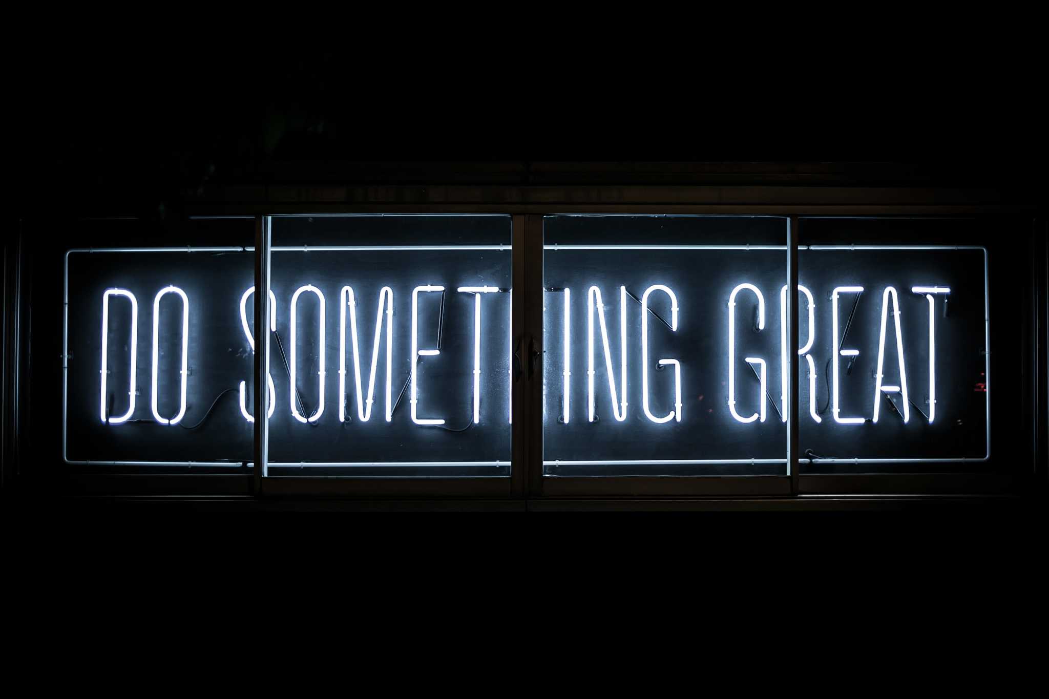 Neon banner saying 'Do something great'